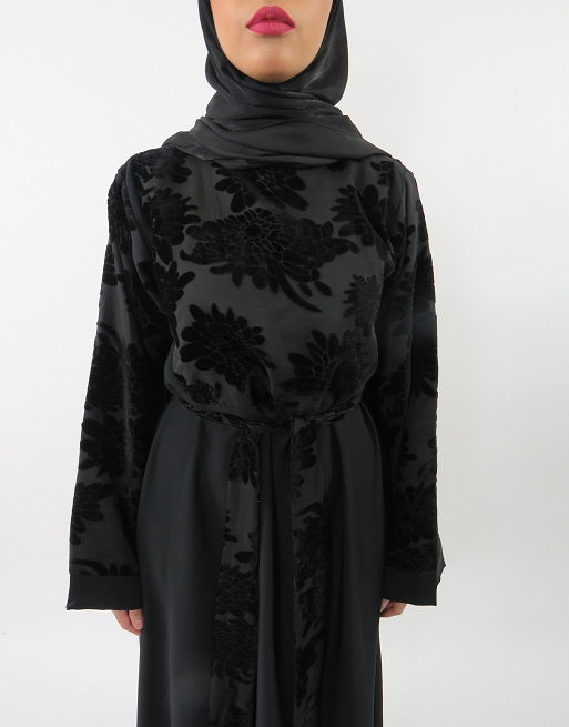 Velvet floral abaya showing slight bell sleeves and shoulder zip detail