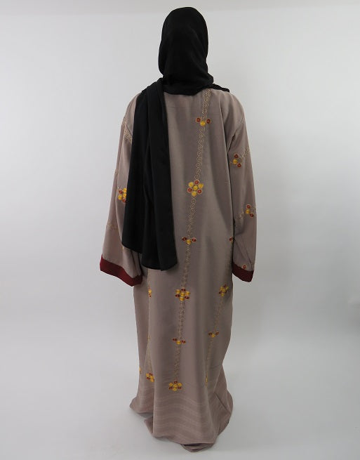 Full-length view of the burgundy open abaya with wide sleeves