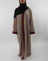 Burgundy open abaya with golden swirl embroidery and V-neckline, front view