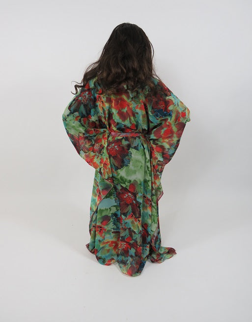 Green floral kids maxi dress showing the flowing full-length skirt