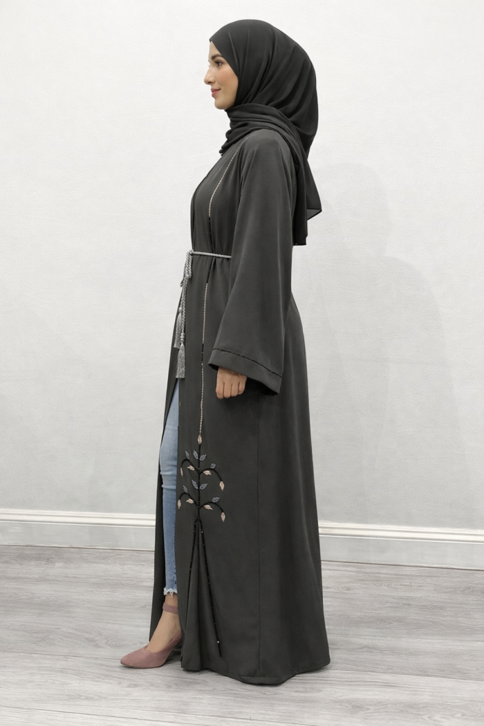 Close-up of the hand-stitched beadwork on the fossil gray abaya