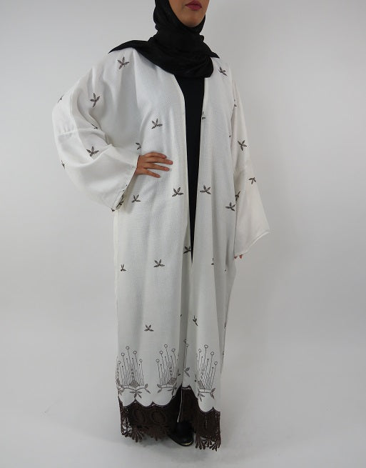 White open kimono jacket layered over an outfit