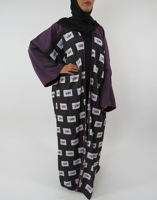 Open kimono jacket layered over a black abaya