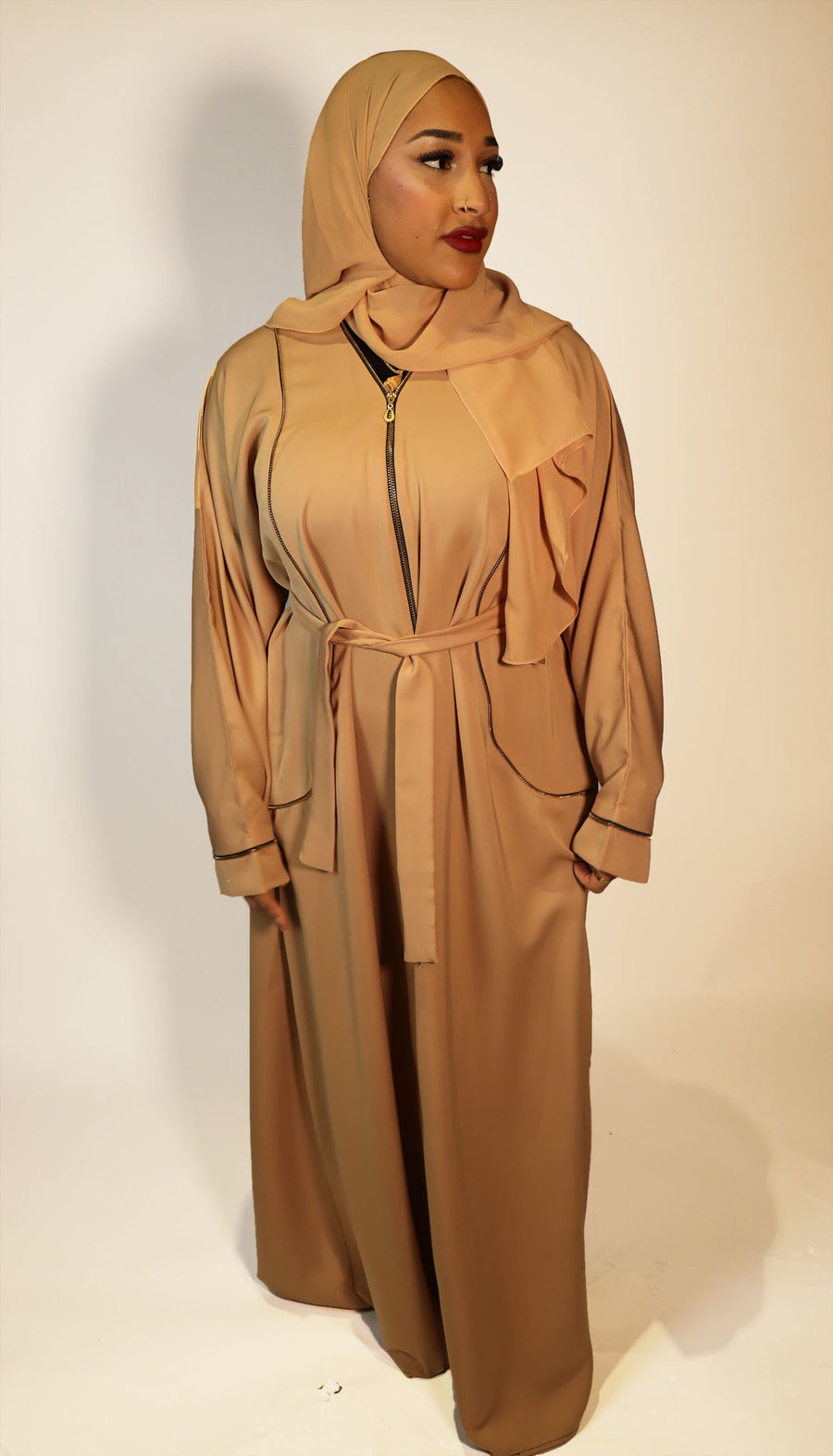 Gold open abaya jacket showing lined zip detail