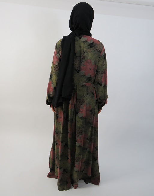 Green floral button-front maxi dress worn open as a layer