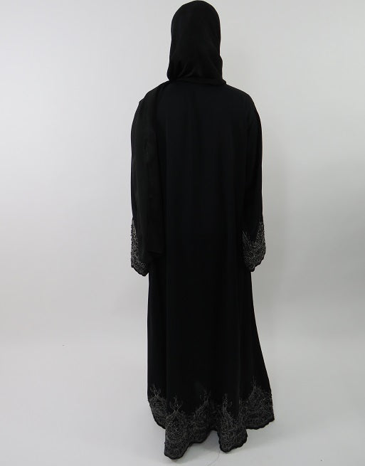 Black open abaya jacket layered over an outfit