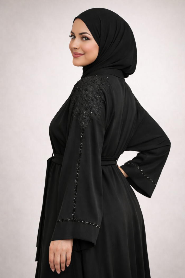 Black abaya jacket worn open as a layer