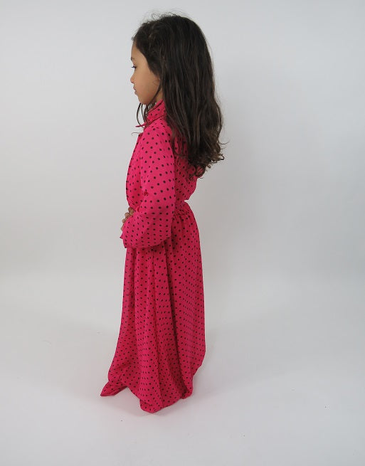 Pink polka-dot kids dress showing shirt collar and button detail