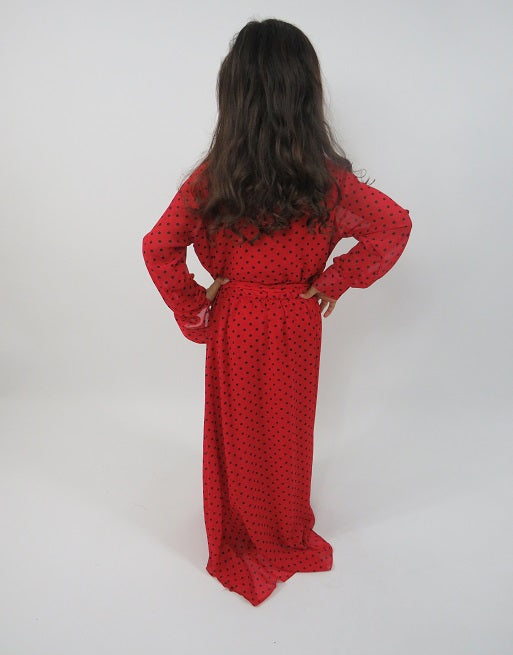 Full-length view of Amani's red polka-dot kids maxi dress with belt