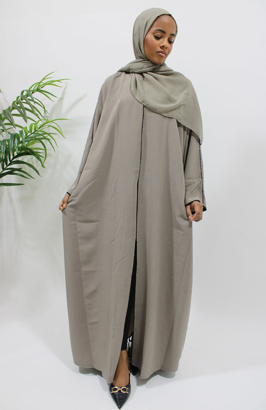 Full-length view of the taupe open abaya with matching hijab