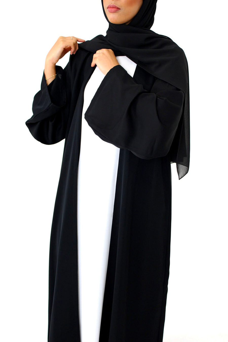 Black duster abaya showing the long, smooth Neda drape