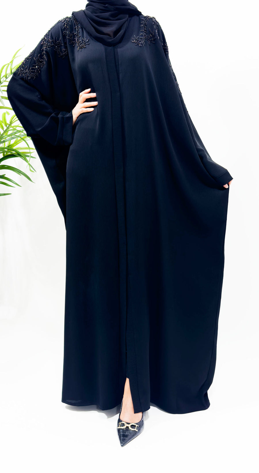 Full-length view of the black embellished batwing abaya with matching hijab