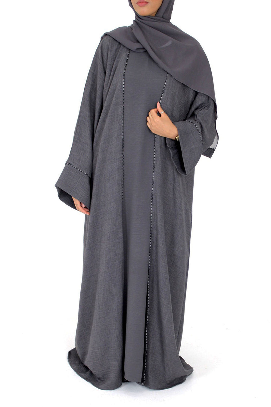 Dainty piping detail on the charcoal grey open abaya