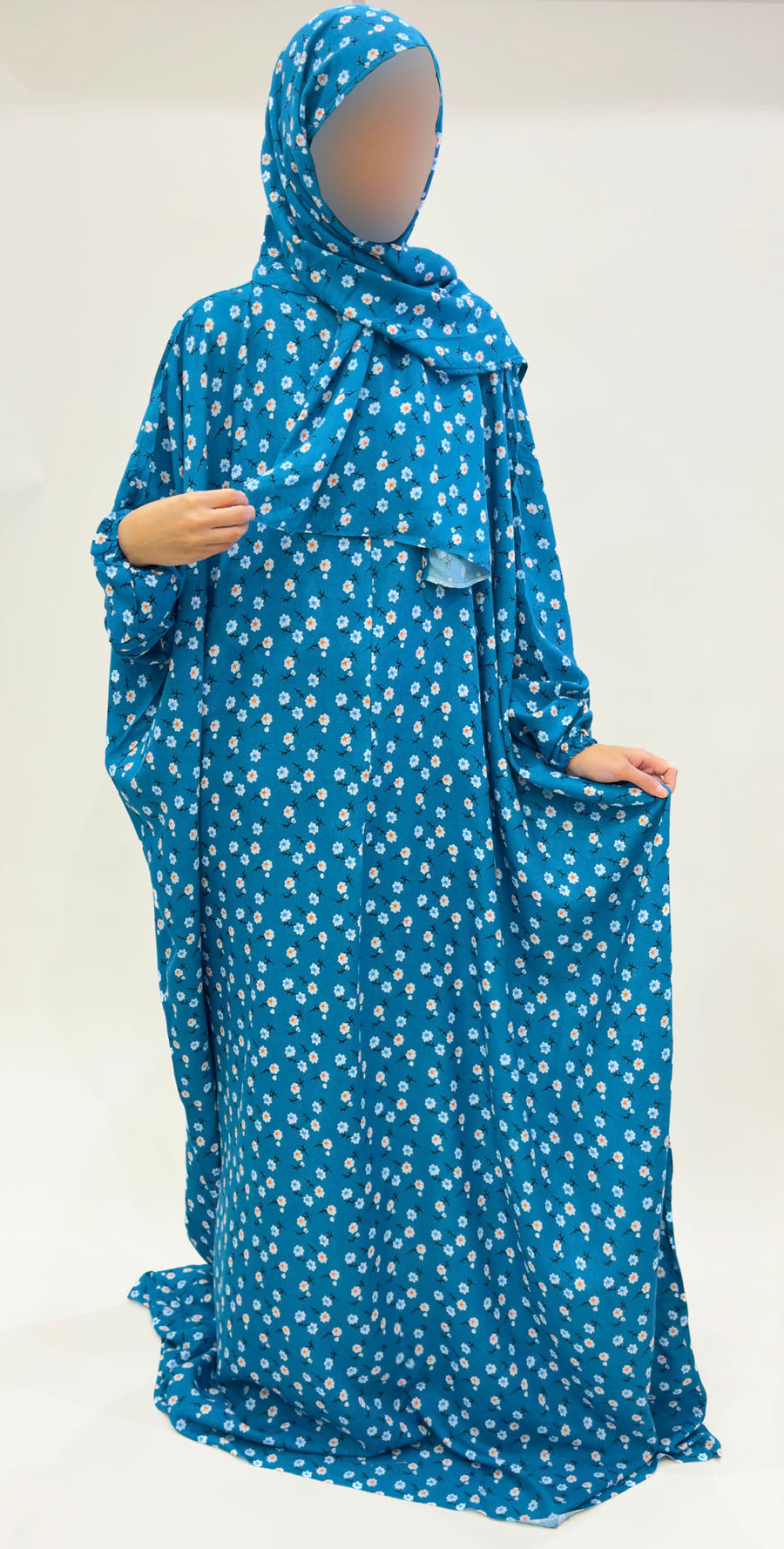 Dark turquoise floral prayer dress showing the attached hijab
