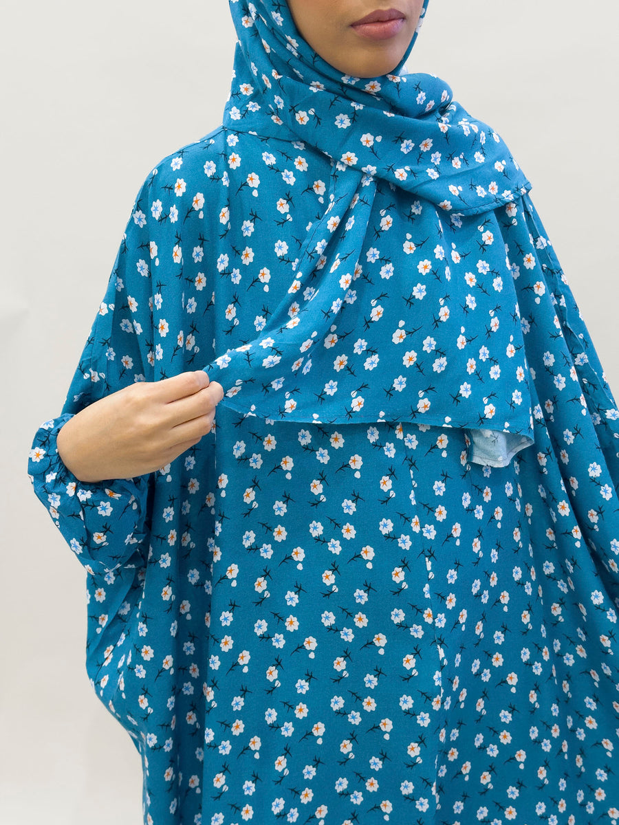 Dark turquoise floral prayer dress showing the print and elasticated cuffs