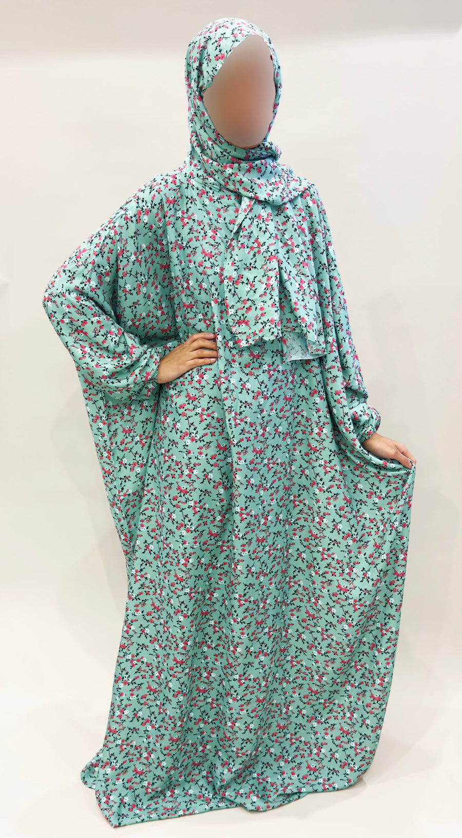 Mint green floral prayer dress showing the attached hijab