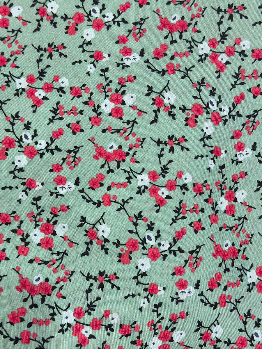 Mint green floral prayer dress showing the print and elasticated cuffs