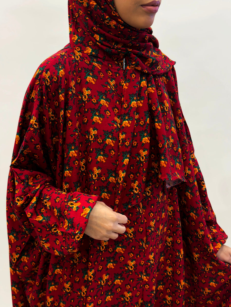 Orange flower floral prayer dress showing the print and elasticated cuffs