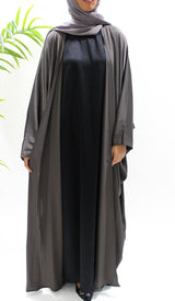 Woman wearing Amani's dark taupe farasha abaya set with matching hijab