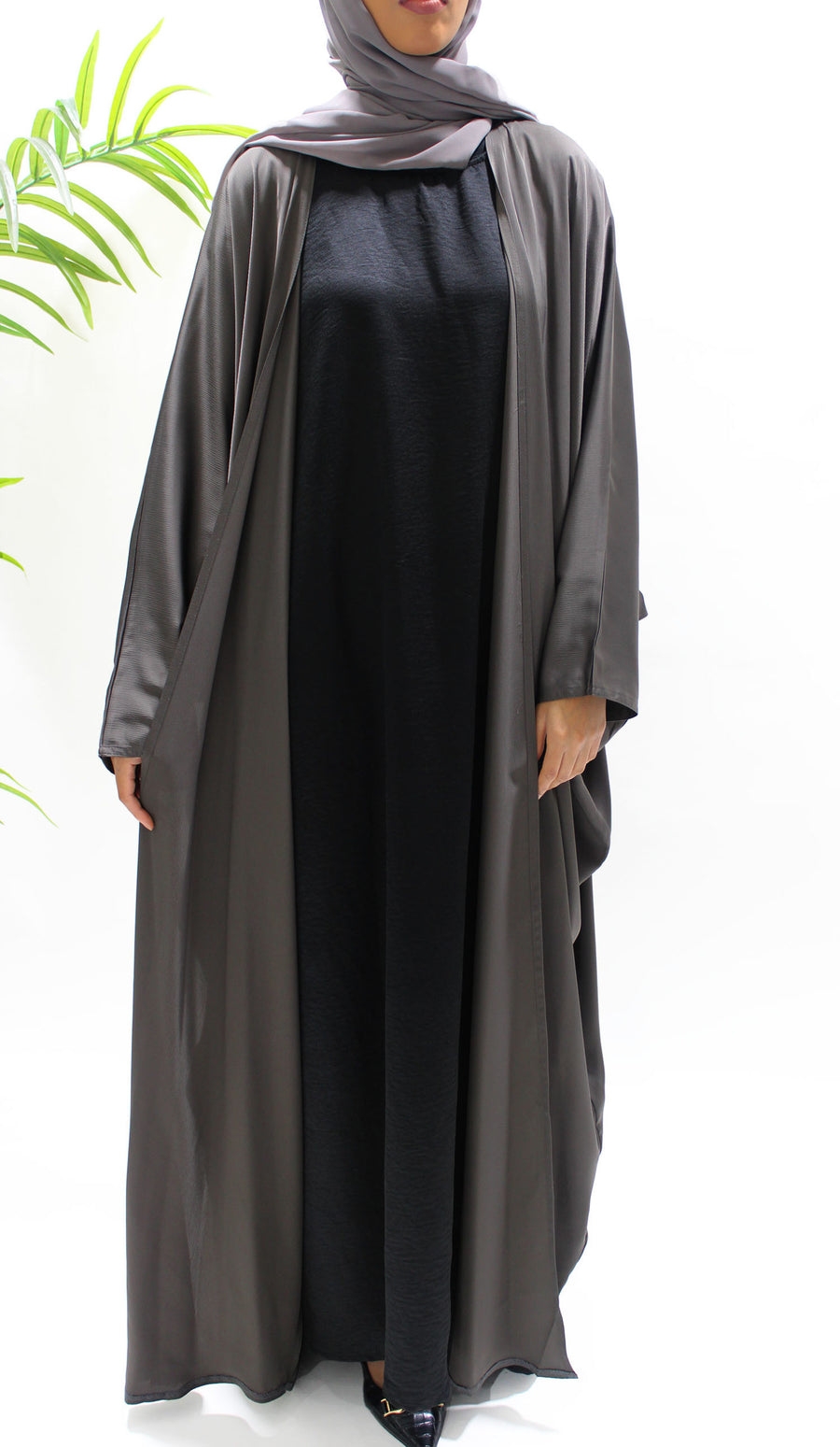 Woman wearing Amani's dark taupe farasha abaya set with matching hijab