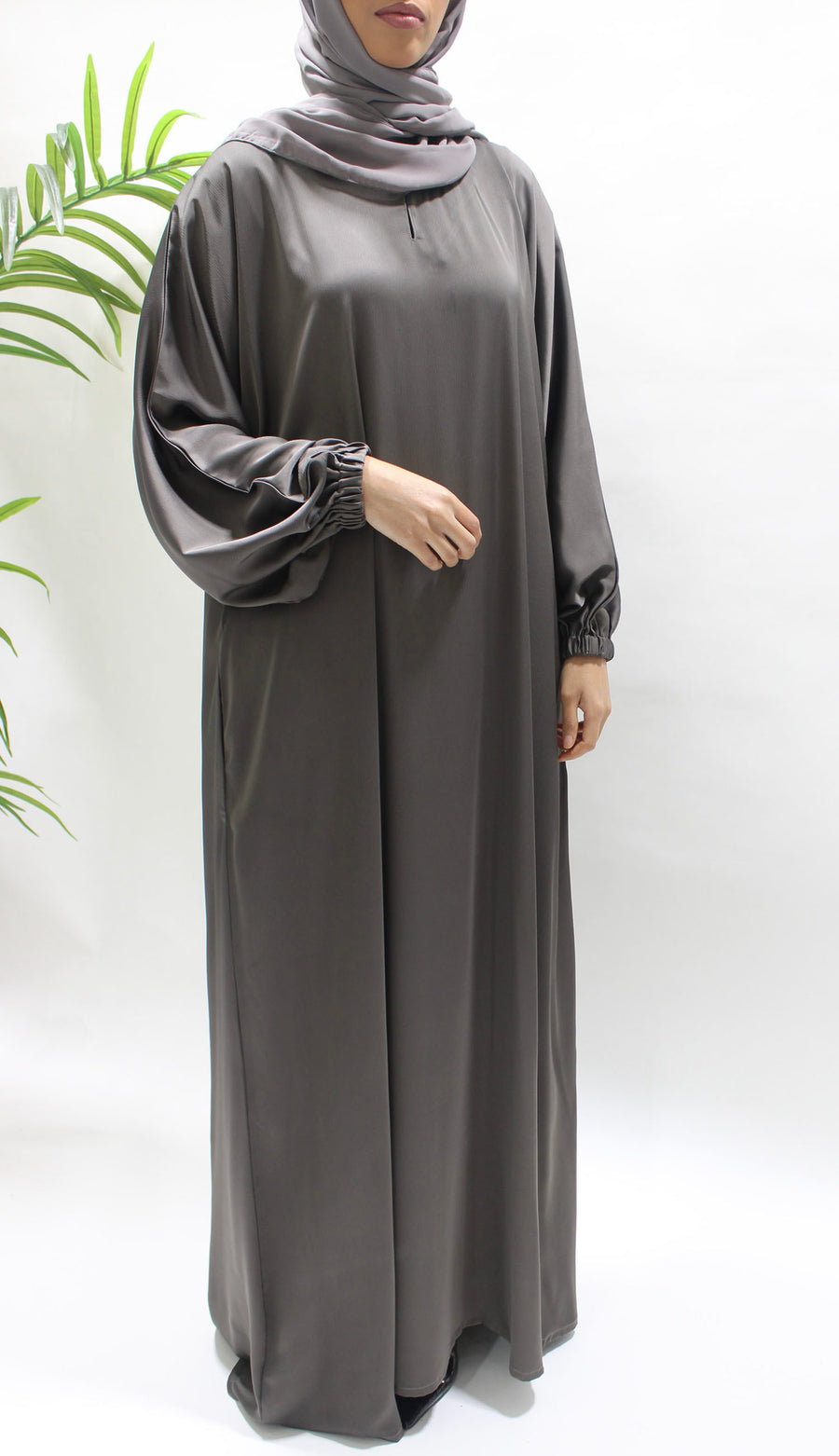 Side pocket on the dark taupe textured satin abaya