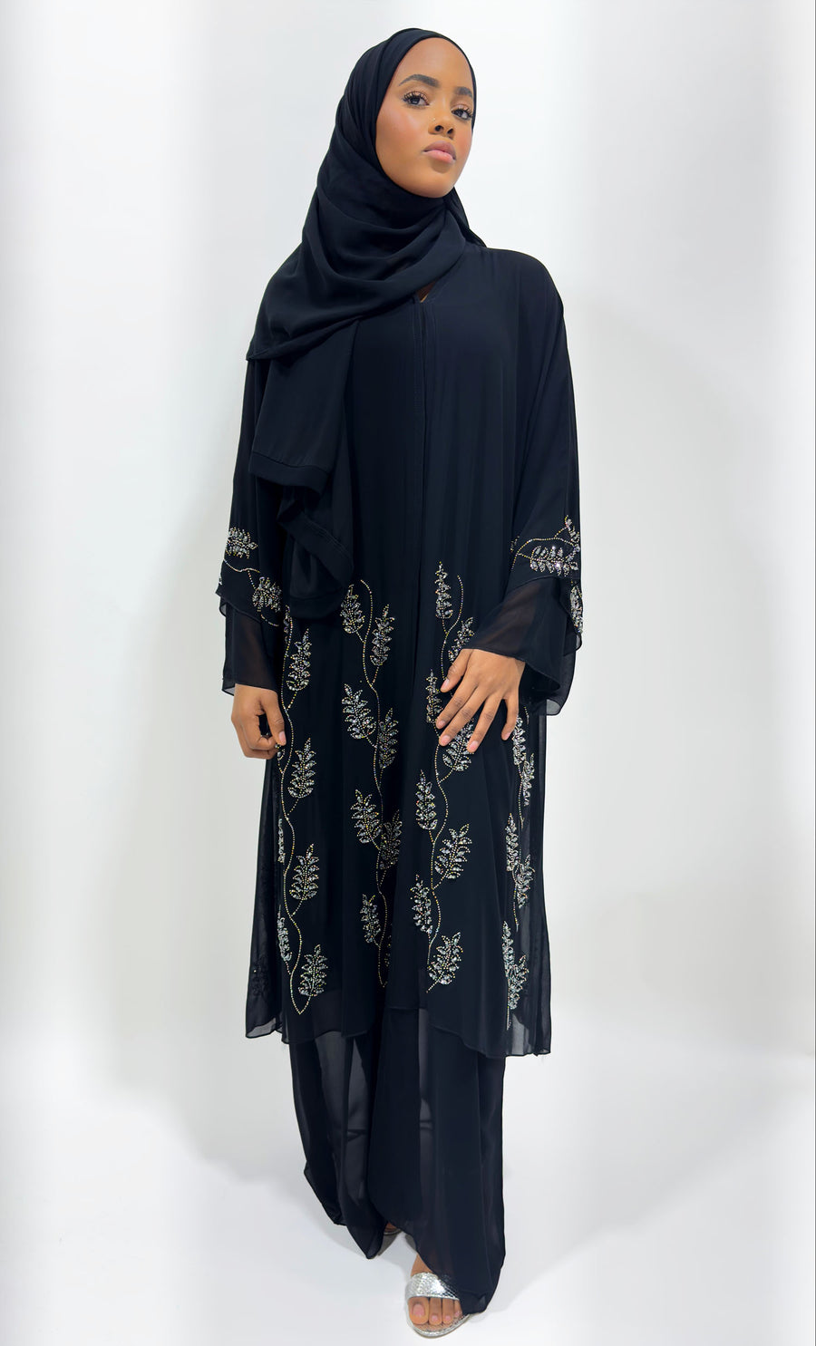 Hand-stitched embellishment on the black chiffon abaya