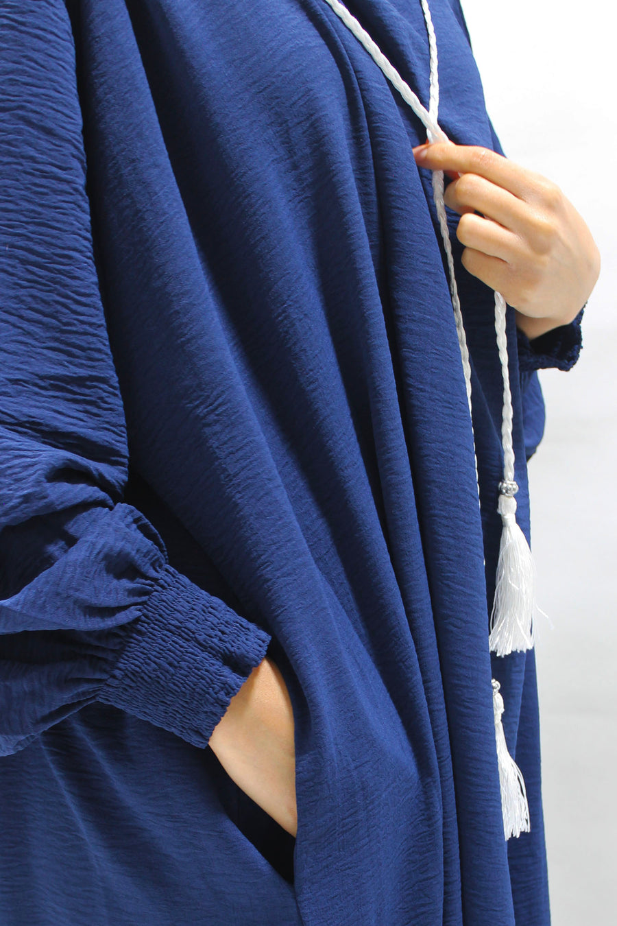 Navy prayer abaya showing the ruched cuffs for wudu