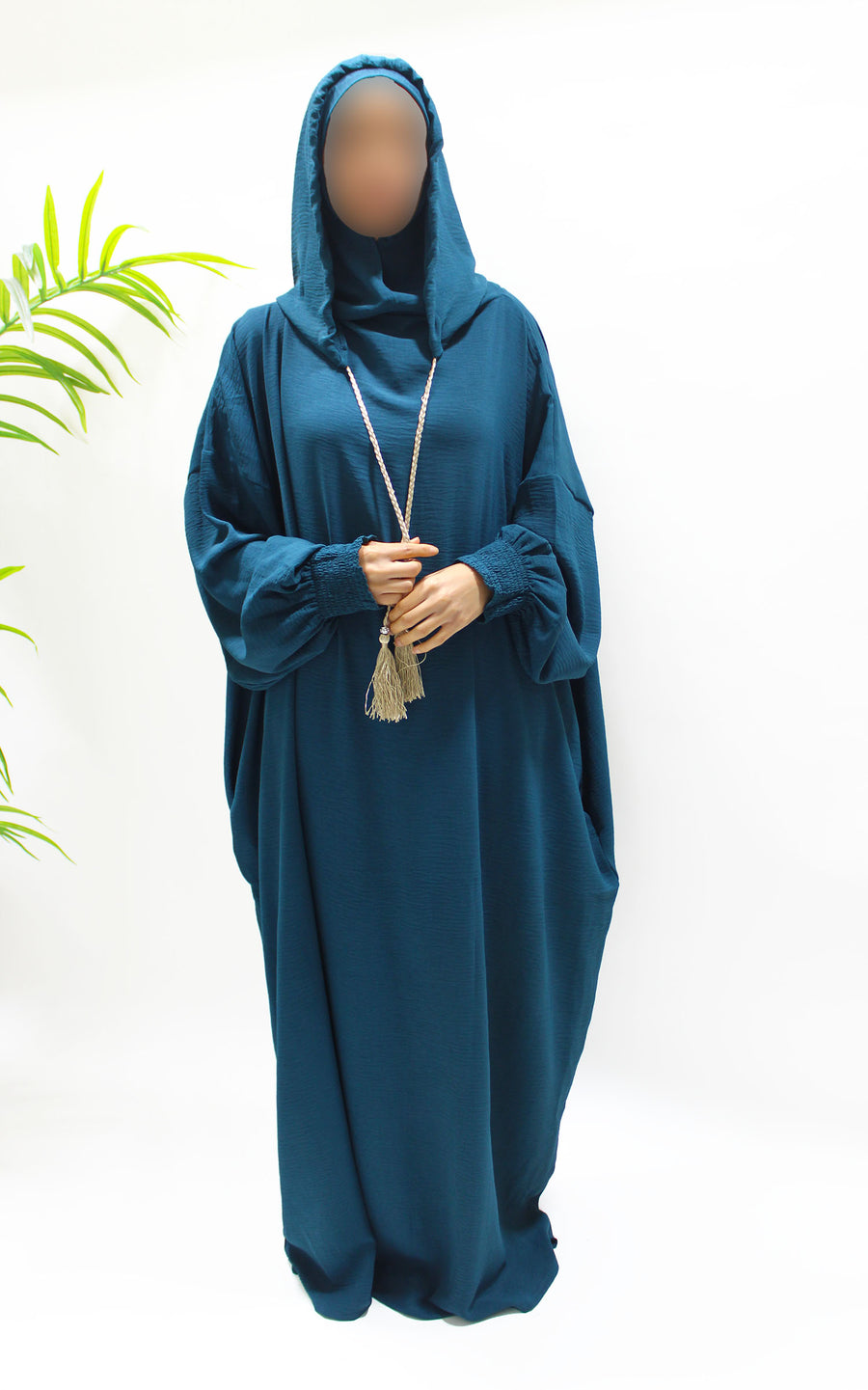 Teal prayer abaya showing the side pockets