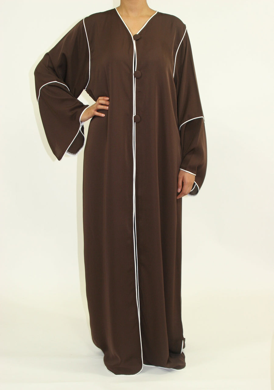 Dark brown A-line jacket showing chest buttons and piping
