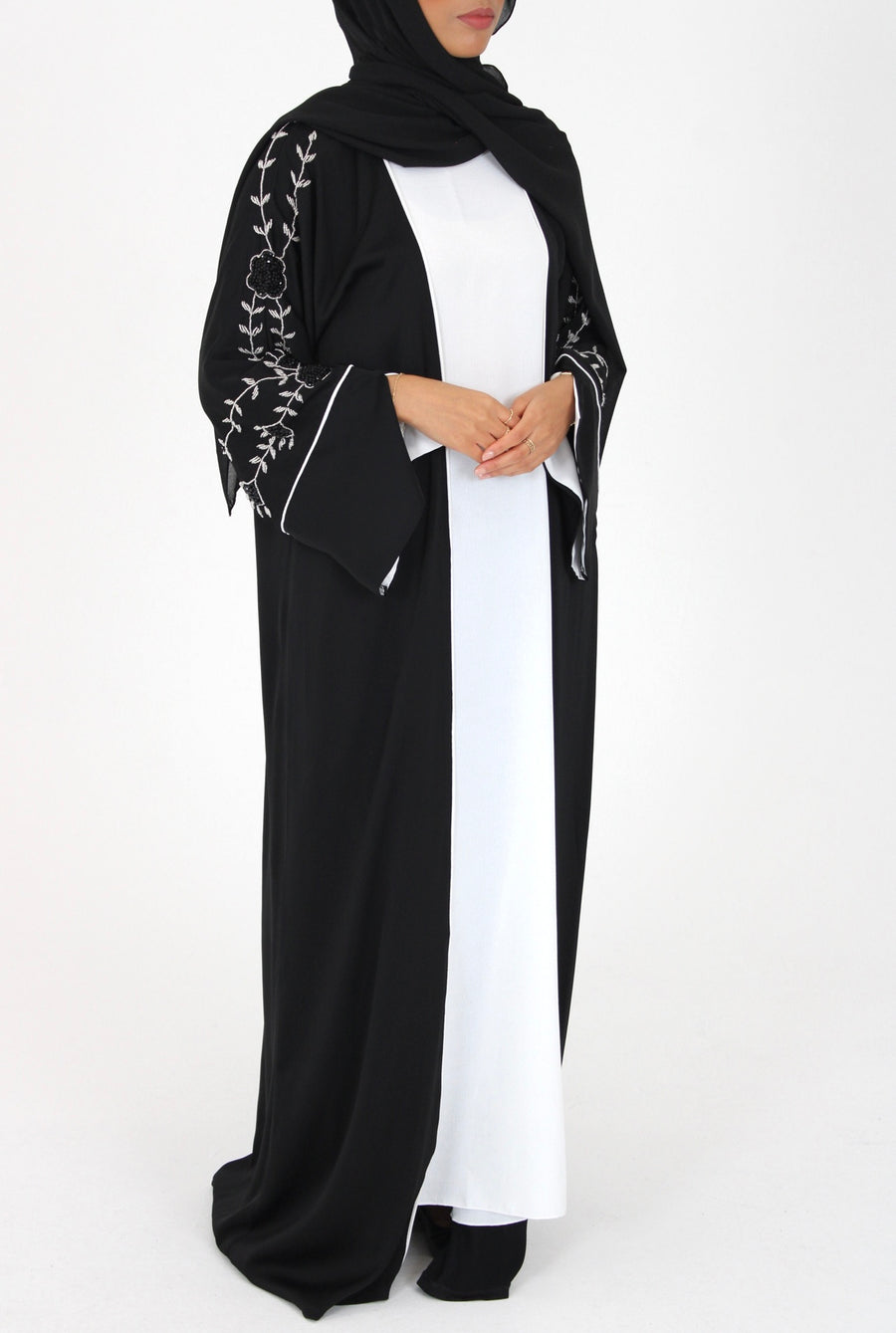 Handmade floral embellishment on the black open abaya