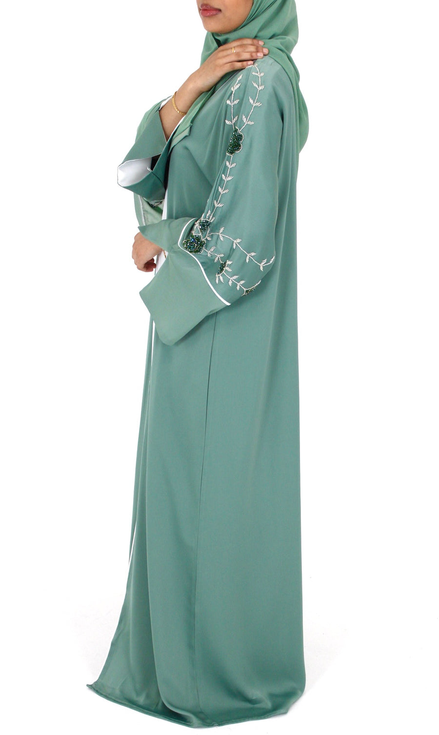 Full-length view of Amani's topaz green floral embellished abaya set
