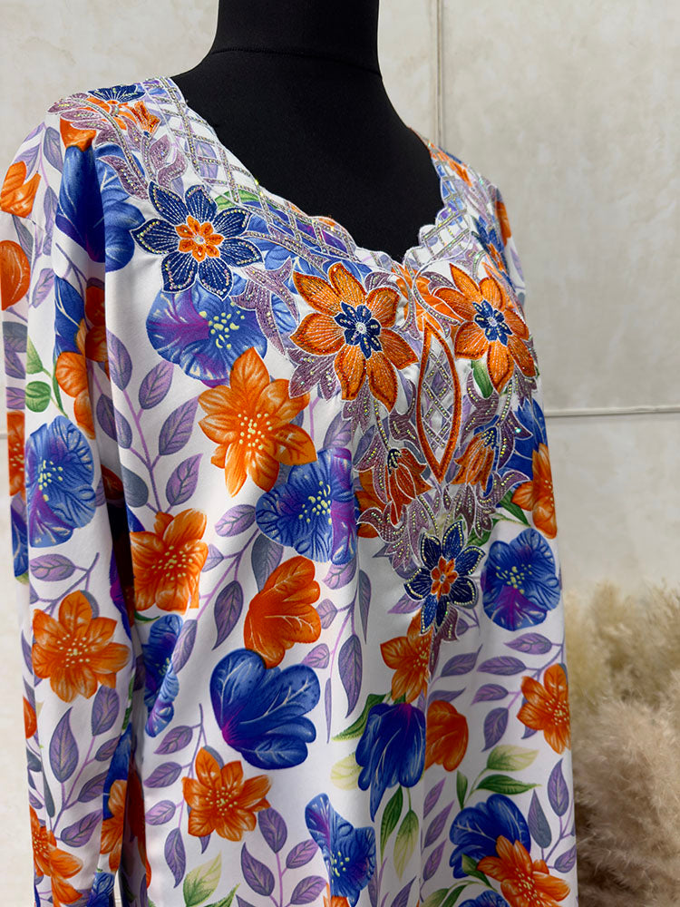 Red and orange mukhawar showing the warm floral print detail