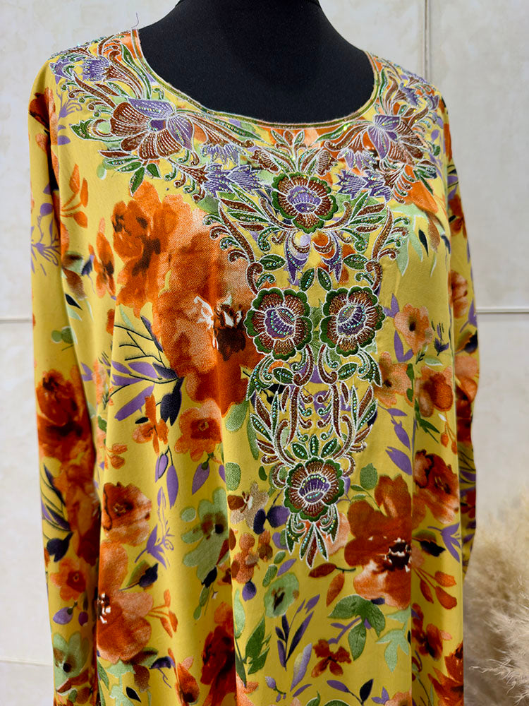 Full-length view of Amani's orange floral mukhawar dress