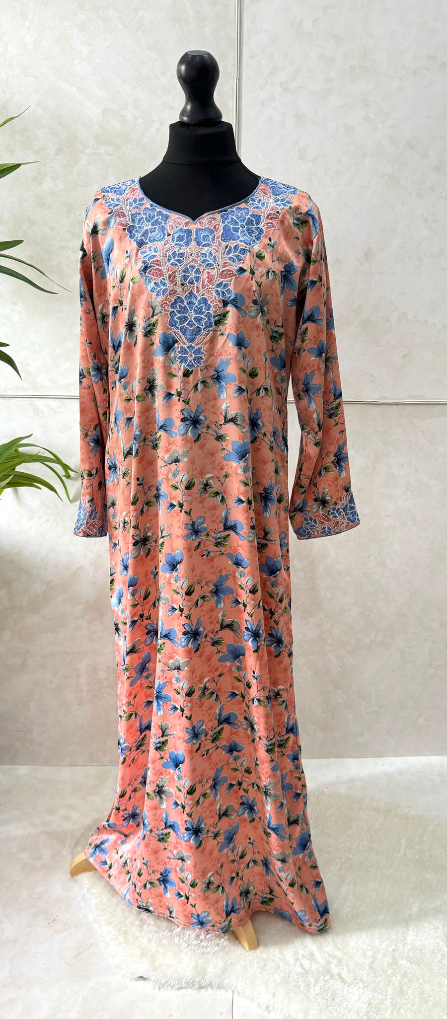 Embroidery and crystal neckline on the peach floral print mukhawar dress