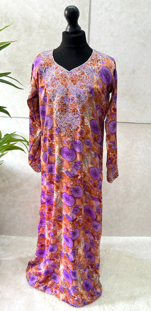 Little girl wearing Amani's purple floral mukhawar dress