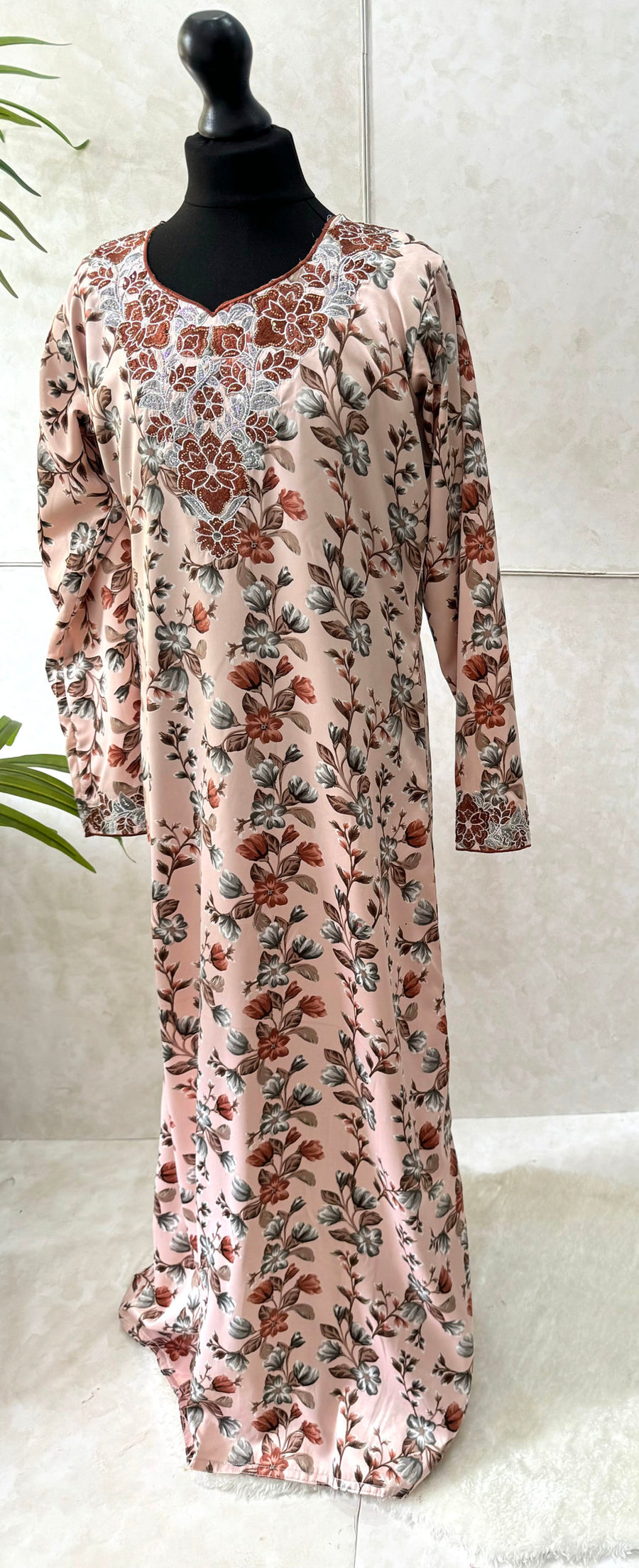 Embroidery and crystal neckline on the soft peach girls' mukhawar dress
