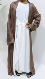 Girl wearing Amani's chocolate open jacket abaya set with inner dress and scarf
