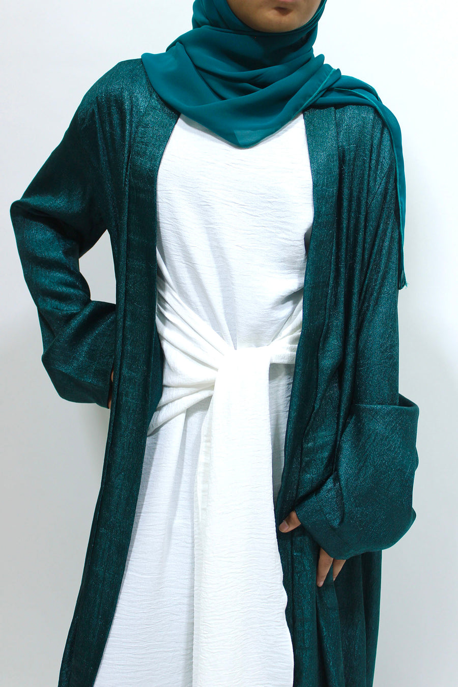 White front-tie inner dress included with the dark teal abaya set