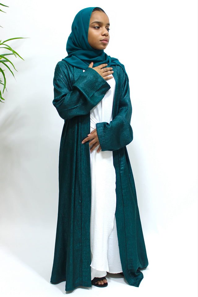 Girl wearing Amani's dark teal open jacket abaya set with inner dress and scarf