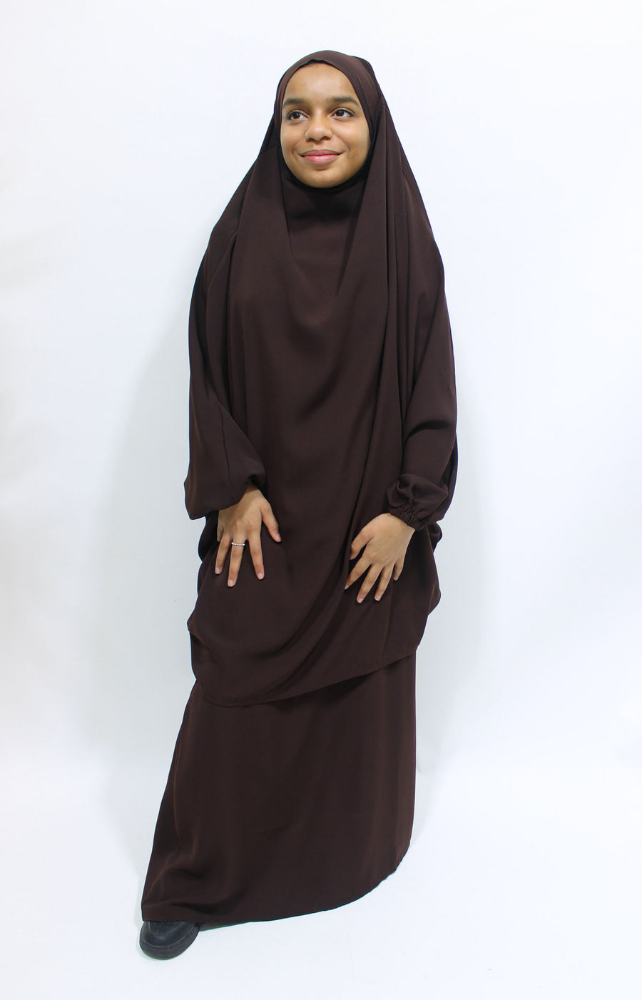 Girl wearing Amani's dark brown jilbab and skirt set with half-jilbab top