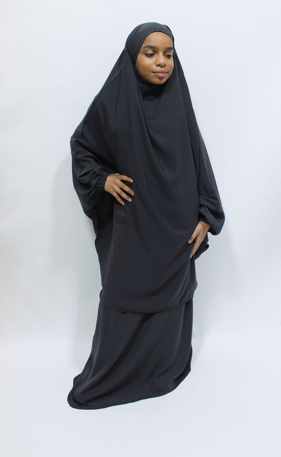 Girl wearing Amani's dark grey jilbab and skirt set with half-jilbab top