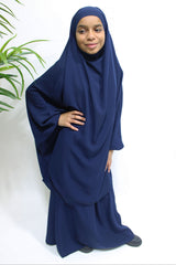 Girl wearing Amani's navy blue jilbab and skirt set with half-jilbab top