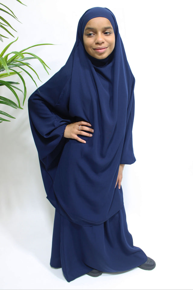 Girl wearing Amani's navy blue jilbab and skirt set with half-jilbab top