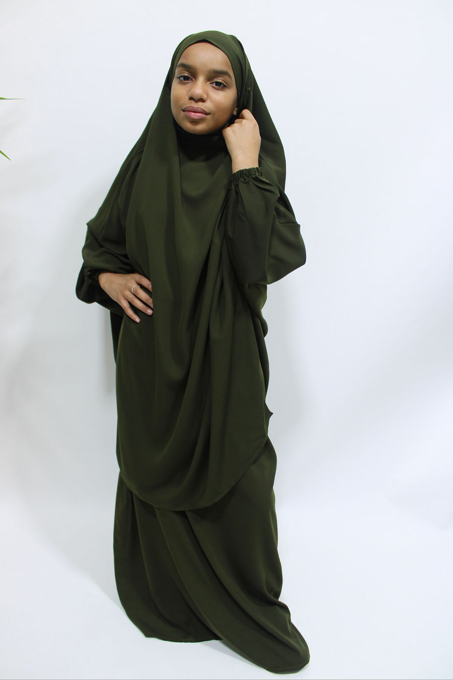 Girl wearing Amani's olive green jilbab and skirt set with half-jilbab top