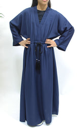 Girl wearing Amani's navy blue draw string abaya with matching scarf