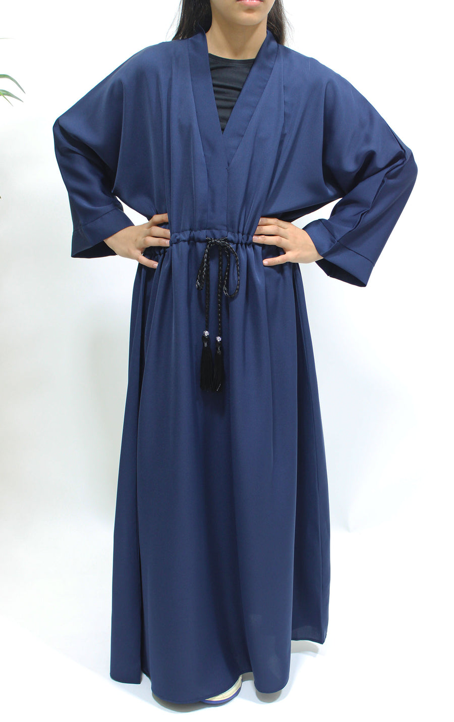 Girl wearing Amani's navy blue draw string abaya with matching scarf