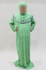 Girls' soft green one-piece prayer dress with attached hijab, front view