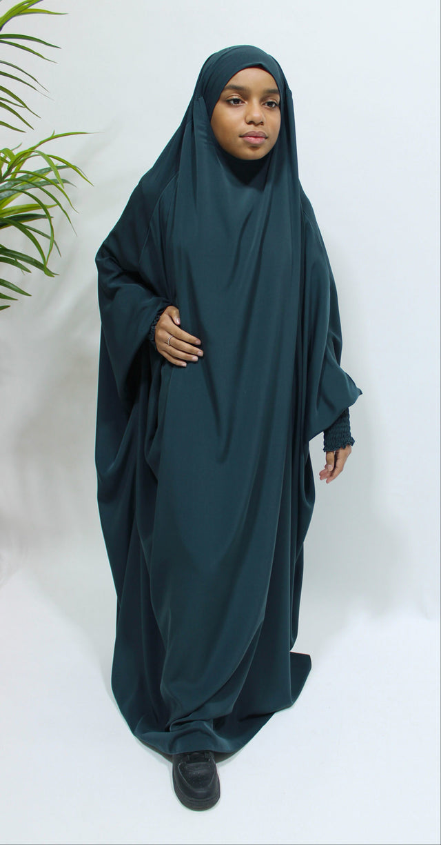 Girl wearing Amani's deep teal ruched cuffs full jilbab