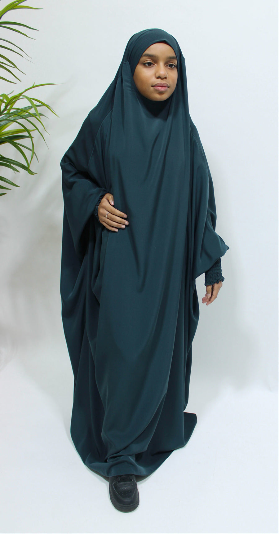 Girl wearing Amani's deep teal ruched cuffs full jilbab