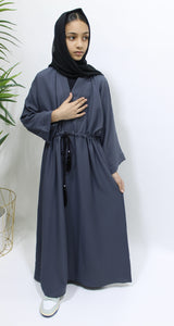 Girl wearing Amani's slate grey draw string abaya with matching scarf